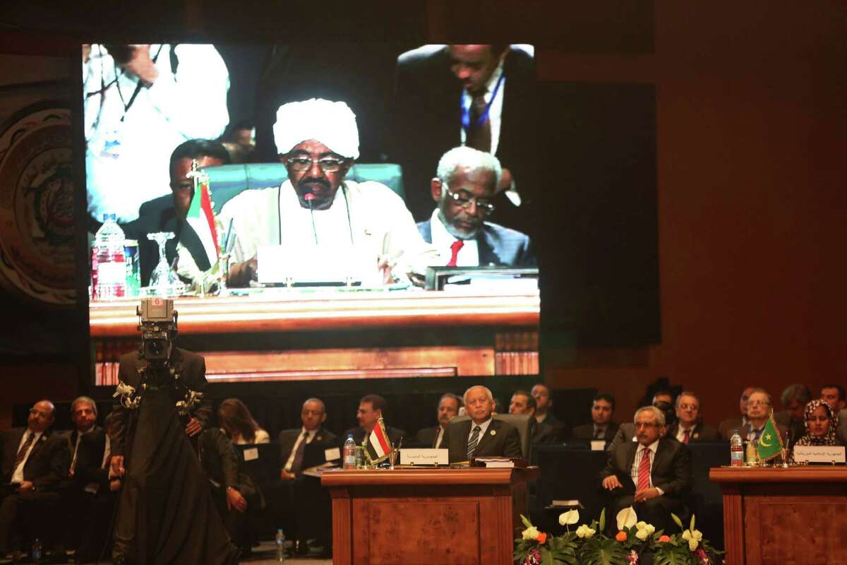 Yemeni President Abdel Rabbo Mansour Hadi, center, attends a meeting of Arab heads of state as Sudanese President Omar al-Bashir speaks, in Sharm el Sheik, South Sinai, Egypt, Saturday, March 28, 2015. Yemen's embattled president on Saturday called Shiite rebels who forced him to flee the country "stooges of Iran," directly blaming the Islamic Republic for the chaos there and demanding airstrikes against rebel positions continue until they surrender. (AP Photo/Thomas Hartwell)