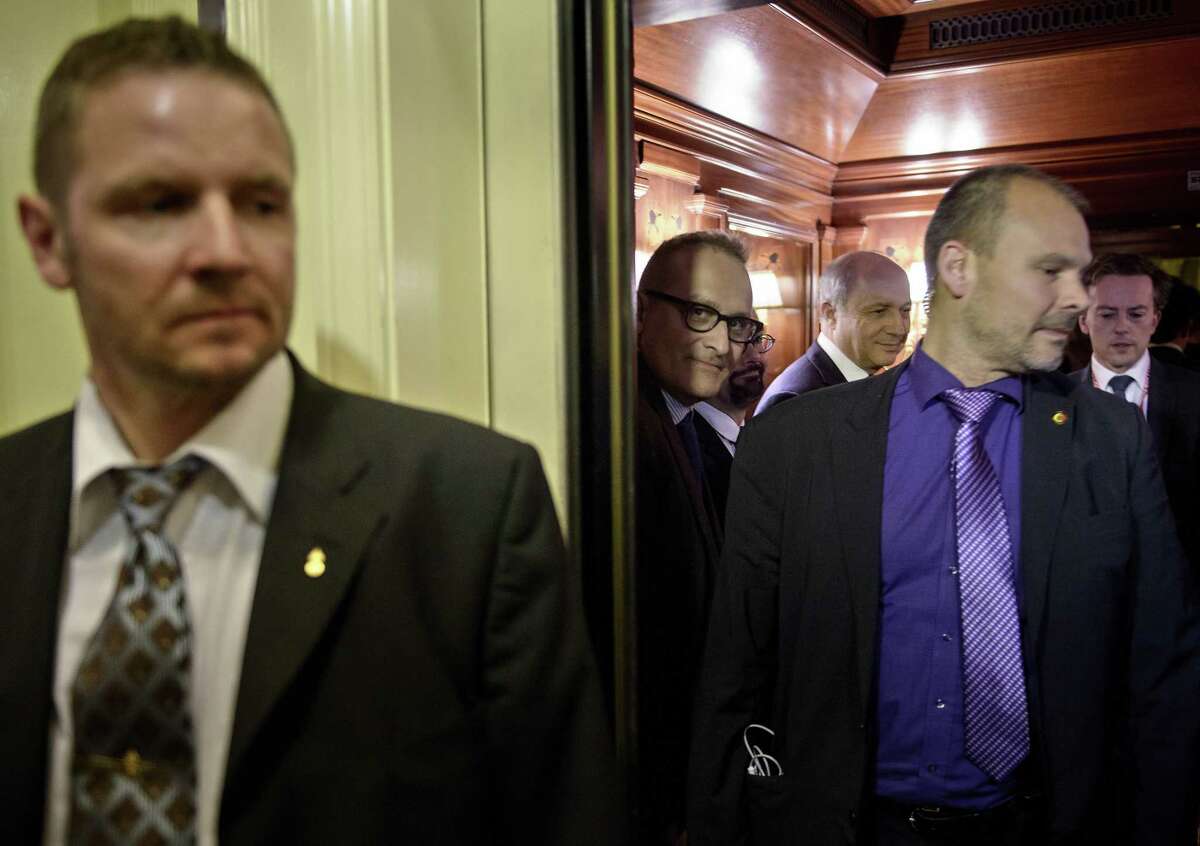 French Foreign Minister, Laurent Fabius, rear left, waits on an elevator at an hotel in Lausanne Saturday, March 28, 2015. Negotiations over Iran's nuclear program picked up pace on Saturday with the French and German foreign ministers joining U.S. Secretary of State John Kerry in talks with Tehran's top diplomat ahead of an end-of-March deadline for a preliminary deal. (AP Photo/Brendan Smialowski, Pool)