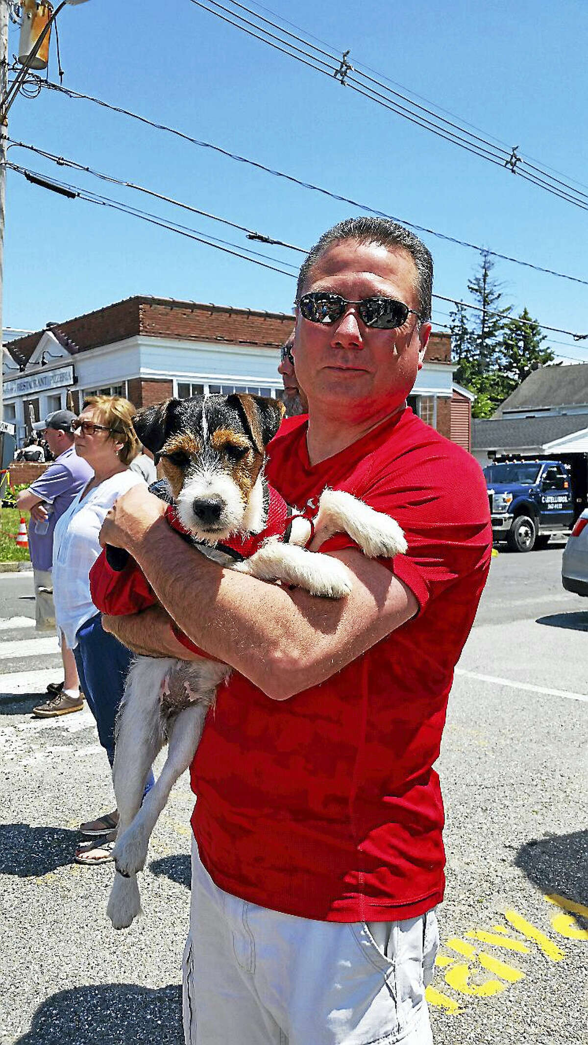 N.F. Ambery photo Jay Kaine of Torrington and his nine-month-old Jack Russell Terrier Tucker watched Kaine’s daughter Jordan race.