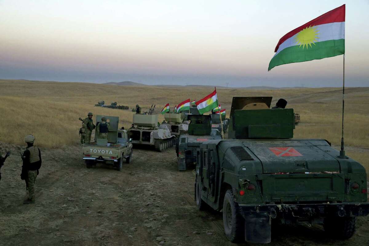 A Peshmerga convoy drives towards a frontline in Khazer, about 30 kilometers (19 miles) east of Mosul, Iraq on Oct. 17, 2016. The Iraqi military and the country’s Kurdish forces say they launched operations to the south and east of militant-held Mosul early Monday morning.