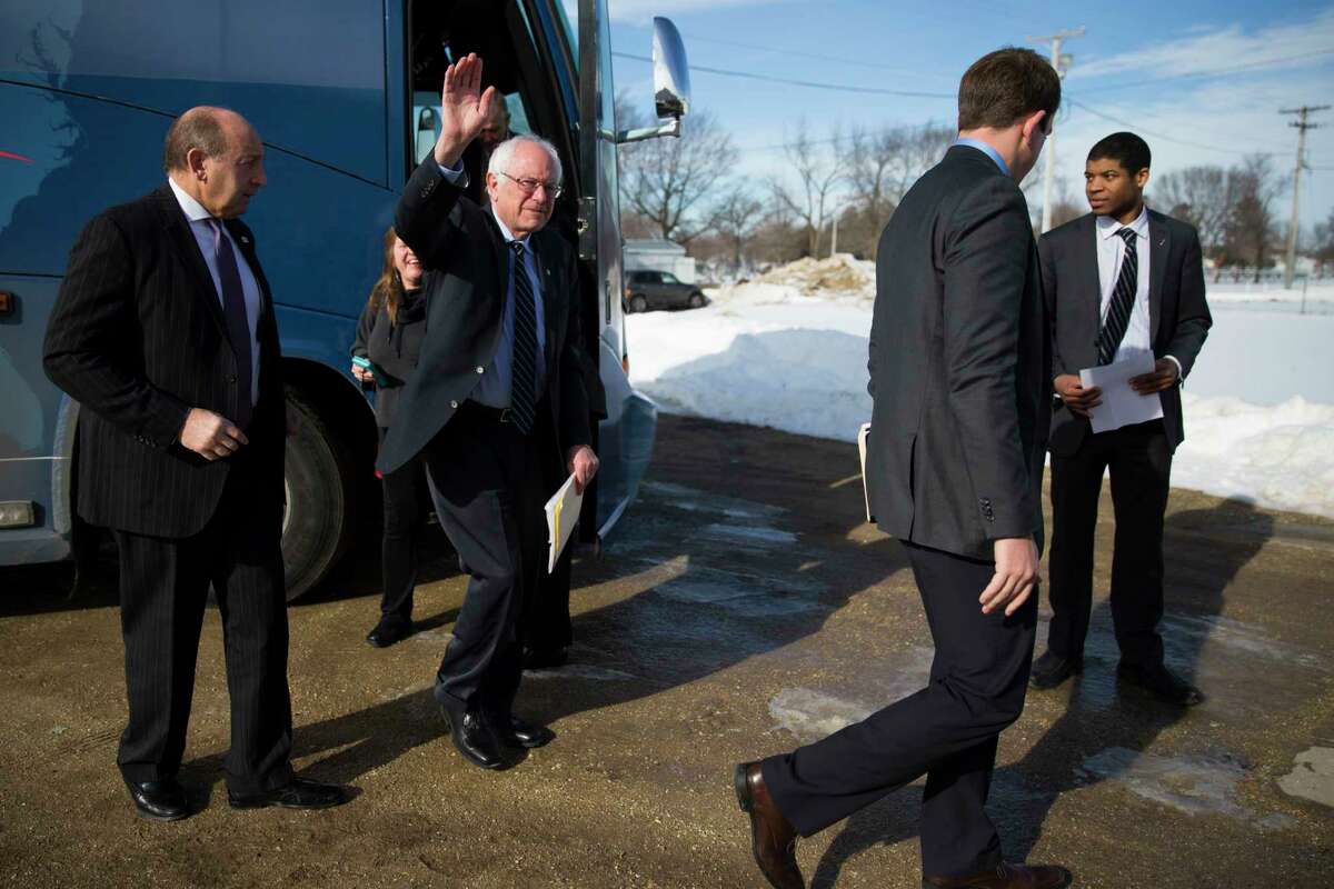 Democratic presidential candidate Sen. Bernie Sanders, I-Vt., waves as he arrives for a campaign rally at Delaware County Fairgrounds Saturday in Manchester, Iowa.