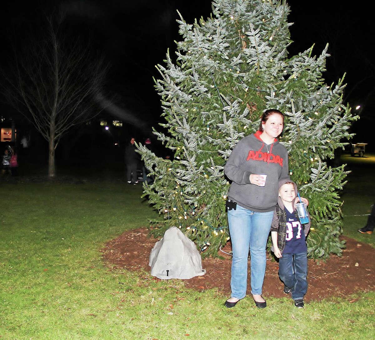 Ashley Chausse of Torrington and her son, Joseph Bessette, 6, at Coe Memorial Park in Torrington for the annual tree lighting event Friday evening.