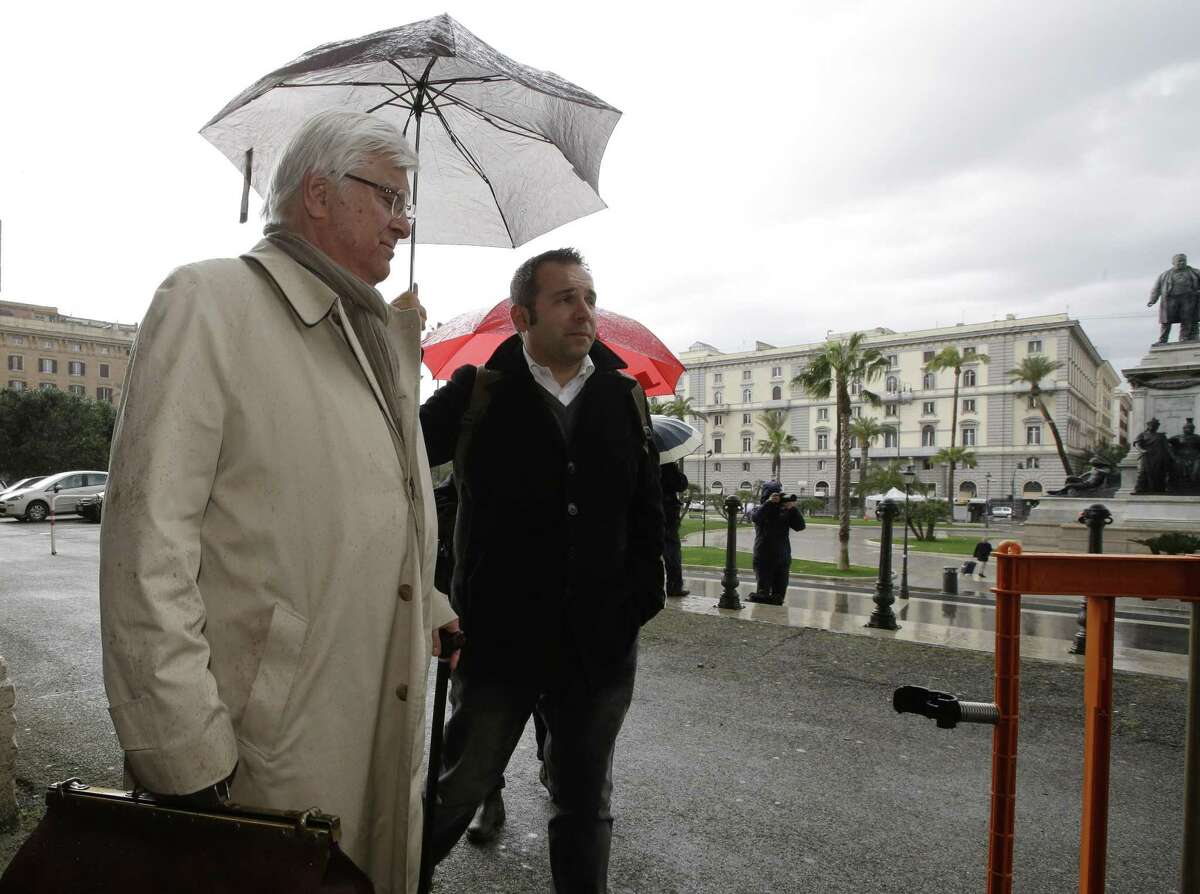 Amanda Knox's lawyer Luciano Ghirga, left, arrives at Italy's highest court building, in Rome, Friday, March 27, 2015. American Amanda Knox and her Italian ex-boyfriend Raffaele Sollecito expect to learn their fate Friday when Italy's highest court hears their appeal of their guilty verdicts in the brutal 2007 murder of Knox's British roommate Meredith Kercher. (AP Photo/Alessandra Tarantino)