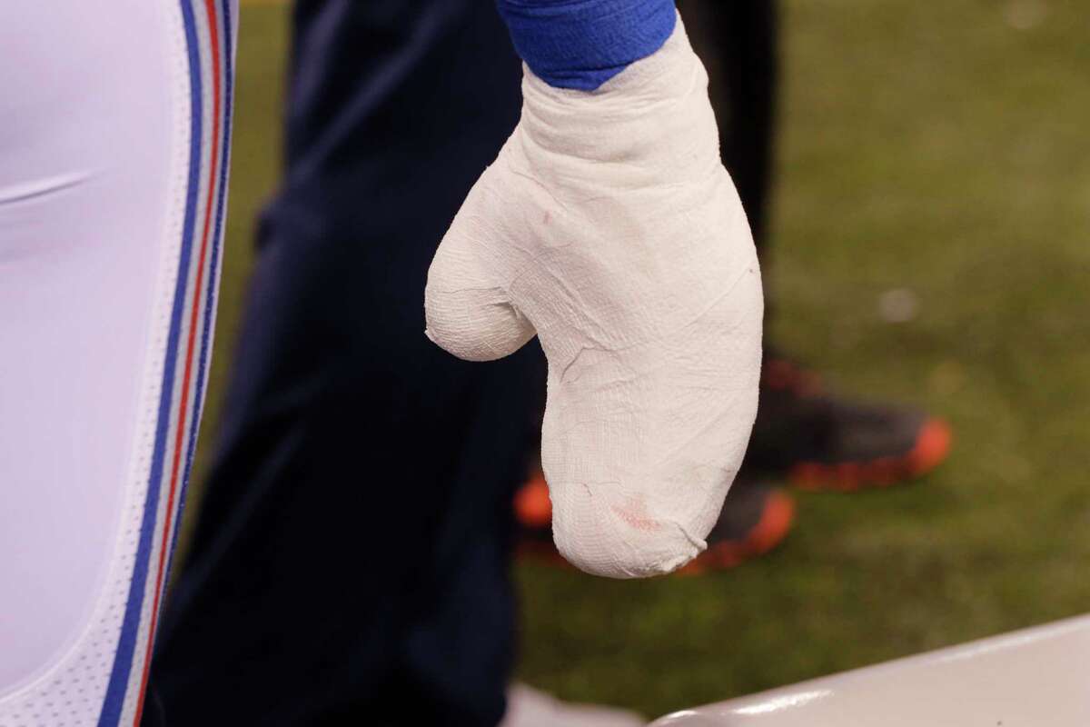 New York Giants defensive end Jason Pierre-Paul’s wrapped hand is shown during the first half of a Nov. 15 game against the New England Patriots.