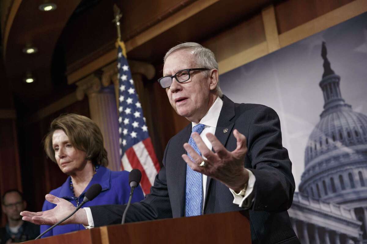 FILE - In this Feb. 26, 2015 file photo, Senate Minority Leader Harry Reid of Nev., accompanied by House Minority Leader Nancy Pelosi of Calif., gestures during a news conference on Capitol Hill in Washington. Reid is announcing he will not seek re-election to another term. The 75-year-old Reid says in a statement issued by his office Friday that he wants to make sure Democrats regain control of the Senate next year and that it would be "inappropriate" for him to soak up campaign resources when he could be focusing on putting the Democrats back in power. (AP Photo/J. Scott Applewhite)