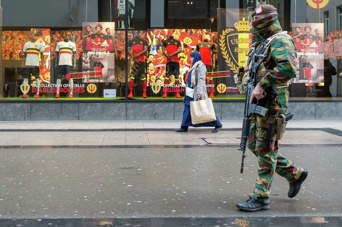 A Belgian Army soldier patrols in a shopping street in the center of Brussels on Nov. 25, 2015. Students in Brussels have begun returning to class after a two-day shutdown over fears that a series of simultaneous attacks could be launched around the Belgian capital.