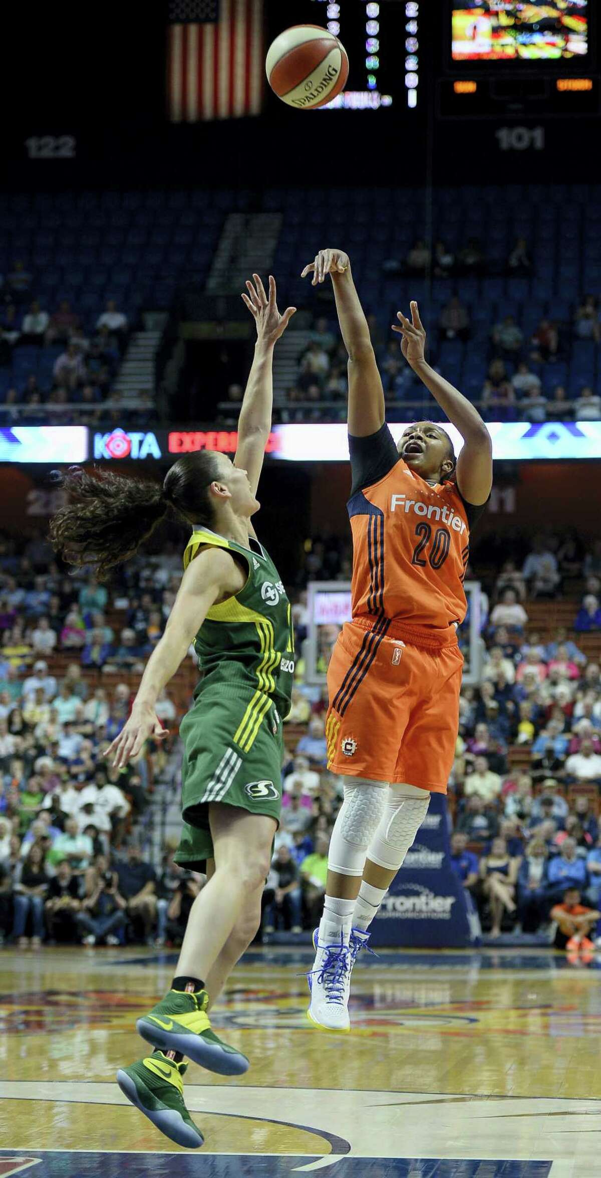 The Sun’s Alex Bentley, right, shoots over the Storm’s Sue Bird during the first half.