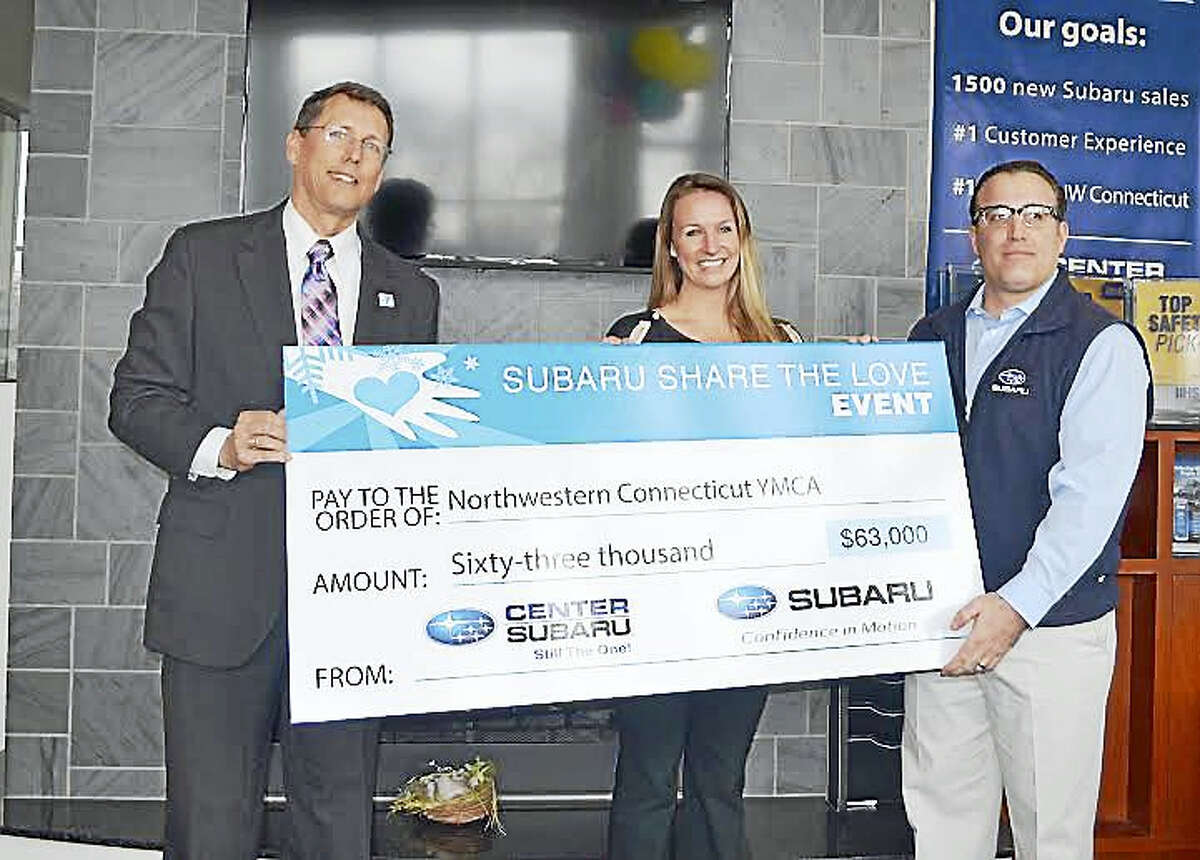 Center Subaru presenting check to Northwestern YMCA on Thursday.
