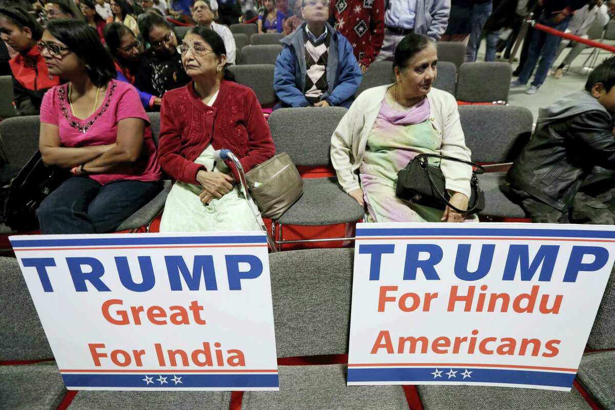 Signs are placed on seats as people wait for a charity event hosted by the Republican Hindu Coalition on Oct. 15, 2016 in Edison, N.J. Republican presidential candidate Donald Trump spoke during the event.