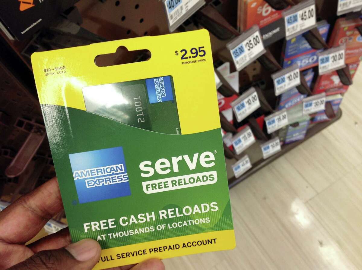 This March 7, 2016 photo shows an American Express Serve prepaid debit card for sale at a store in New York. Federal regulators announced new rules on Oct. 5, 2016, governing the quickly growing prepaid debit card industry, an effort more than two years in the making, which should bring basic account protections to its customers that are often the poor and financially disadvantaged.