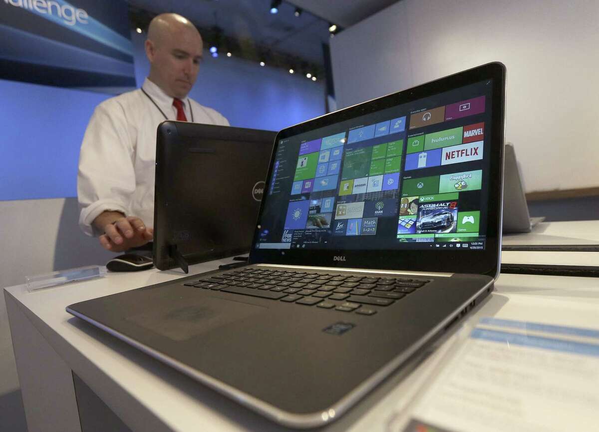 In this April 29, 2015 photo, a Dell laptop computer running Windows 10 is on display at the Microsoft Build conference in San Francisco.