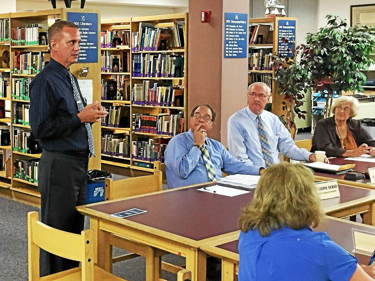 Robert Travaglini, the receiver currently tasked with running the Winchester public schools, addresses the Gilbert School Corp. board in Winsted during a meeting.