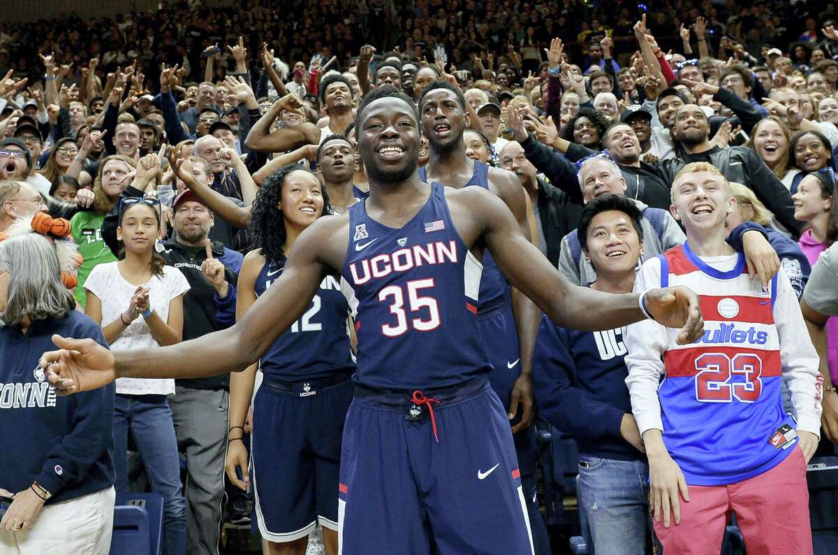 UConn’s Amida Brimah (35) stands with fans and players during Friday’s First Night event in Storrs.