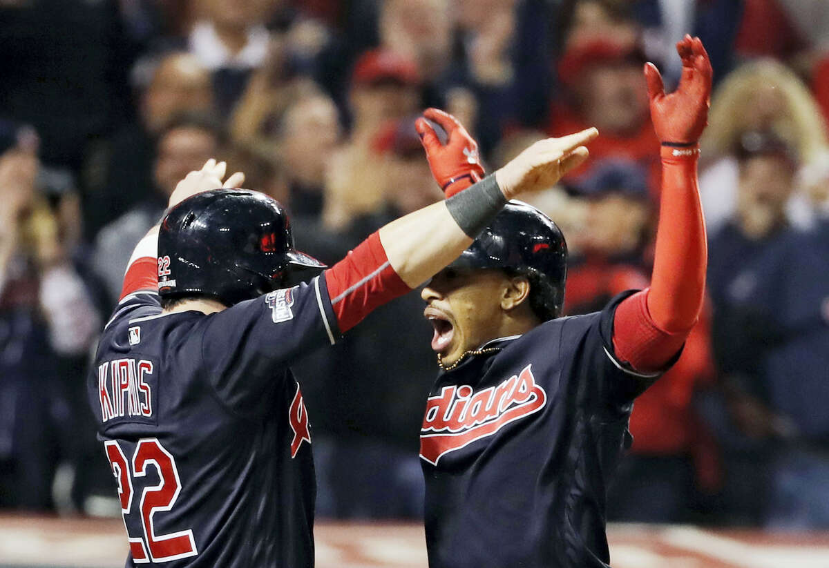 Francisco Lindor, right, celebrates after his two-run home run in the sixth inning on Friday.