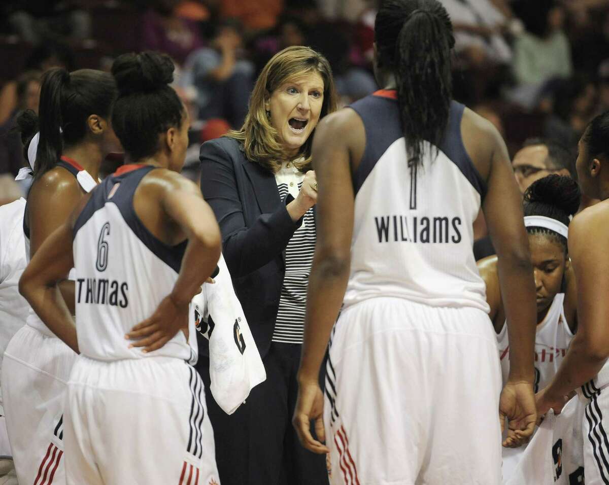 Connecticut Sun head coach Anne Donovan, center, talks to her team during the second half of a game against the Indiana Fever Tuesday. Indiana won in overtime, 75-73.