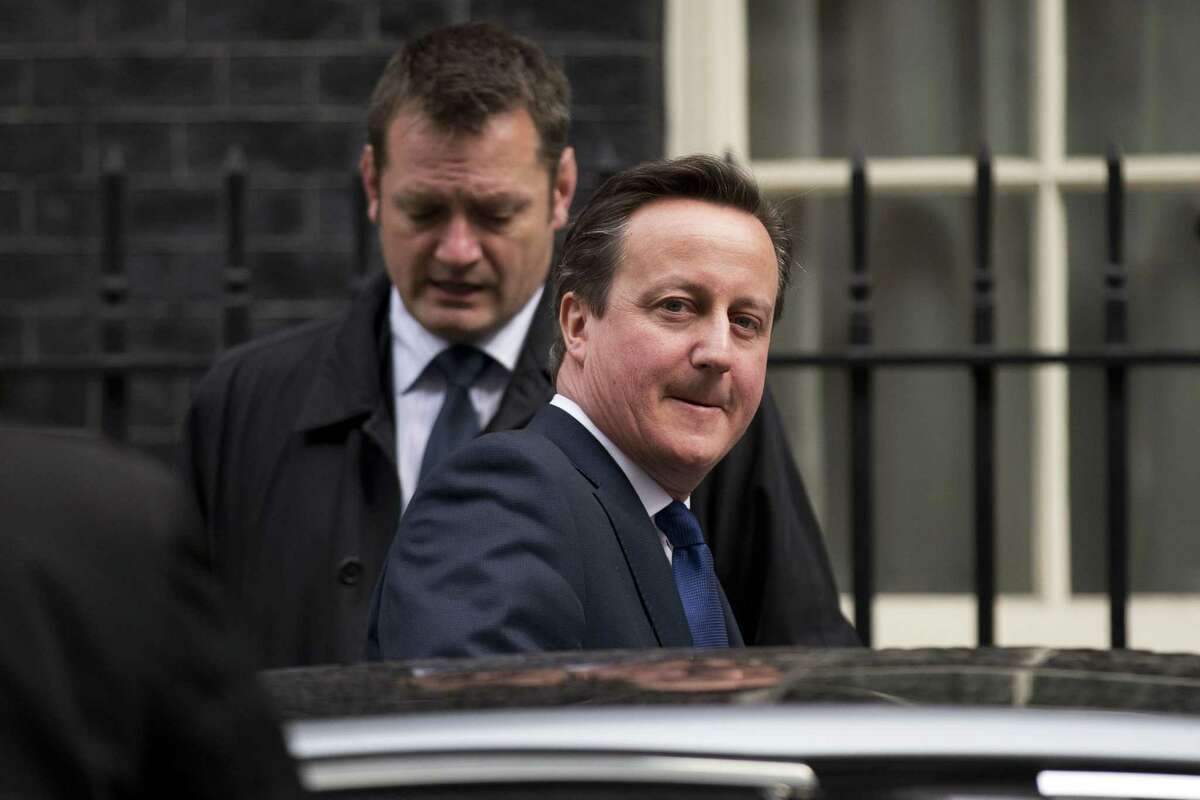 British Prime Minister David Cameron gets in a car as he leaves 10 Downing Street in London, to attend Prime Minister's Questions at the Houses of Parliament, Wednesday, March 25, 2015. (AP Photo/Matt Dunham)