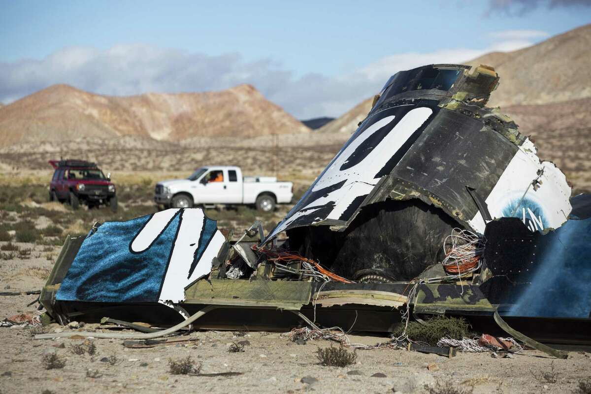 In this Nov. 1, 2014 photo, wreckage lies near the site where a Virgin Galactic space tourism rocket, SpaceShipTwo, exploded and crashed in Mojave, Calif.