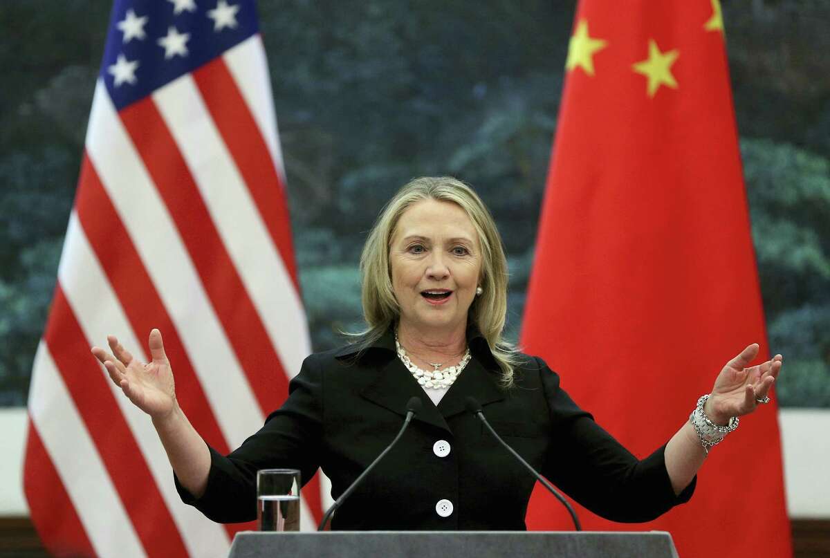 FILE - In this Sept. 5, 2012 file photo, then U.S. Secretary of State Hillary Clinton speaks during her joint conference with Chinese Foreign Minister Yang Jiechi at the Great Hall of the People in Beijing when talks between Clinton and Chinese leaders failed to narrow gaps on how to end the crisis in Syria and how to resolve Beijing’s territorial disputes with its smaller neighbors over the South China Sea. Clinton privately said the U.S. would “ring China with missile defense” if the Chinese government failed to curb North Korea’s nuclear program, a potential hint at how the former secretary of state would act if elected president. Clinton’s remarks were revealed by WikiLeaks in a hack of the Clinton campaign chairman’s personal account. (Feng Li/Pool Photo via AP, File)