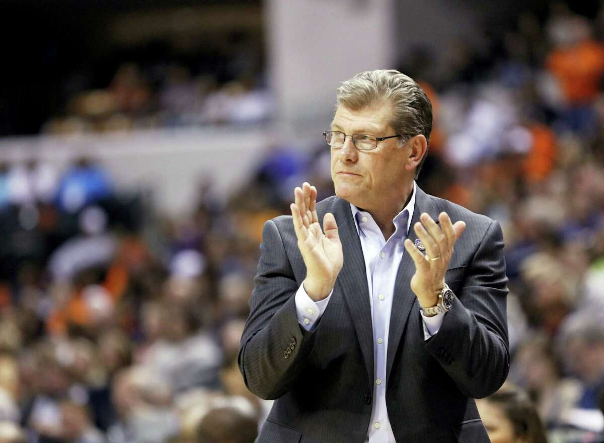 Connecticut head coach Geno Auriemma cheers for his team during the second half of a national semifinal game against Oregon State, at the women's Final Four in the NCAA college basketball tournament Sunday, April 3, 2016, in Indianapolis. Connecticut won 80-51. (AP Photo/AJ Mast)