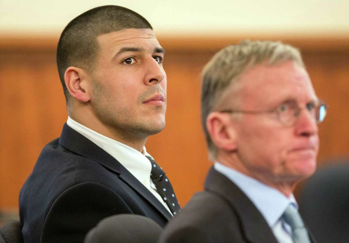 Former New England Patriots NFL football player Aaron Hernandez, left, sits beside his lawyer Charles Rankin during his murder trial at Bristol County Superior Court, Tuesday, March 24, 2015, in Fall River, Mass. Hernandez is charged with killing semiprofessional football player Odin Lloyd in June 2013.