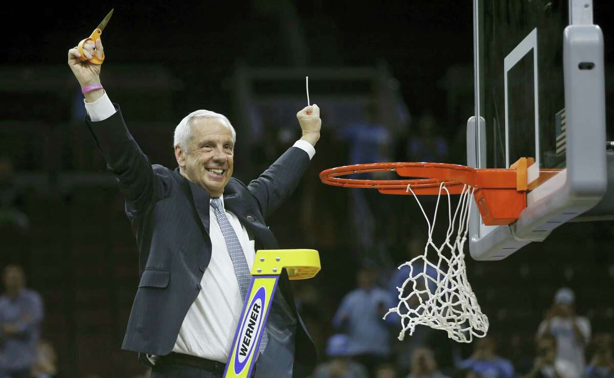 North Carolina head coach Roy Williams reacts after cutting the net after a regional final men's college basketball game against Notre Dame in the NCAA Tournament, Sunday, March 27, 2016, in Philadelphia. North Carolina won 88-74 to advance to the Final Four. (AP Photo/Matt Rourke)