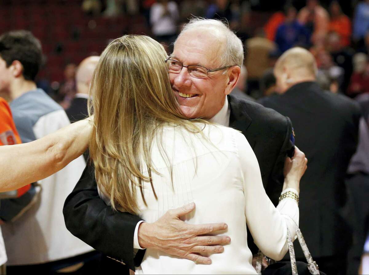 Syracuse head coach Jim Boeheim hugs his wife Julie after the Orange became the first No. 10 seed to earn a berth to the Final Four Sunday.