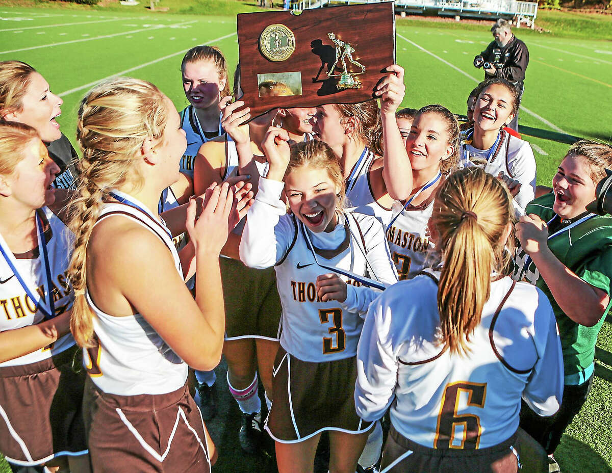 Thomaston Golden Bears celebrate their 2-1 win over The Haddam-Killingworth Courgars 2-1 to claim the CIAC Class S Field Hockey crown at Weathersfield High School Saturday-John Vanacore/New Haven Register