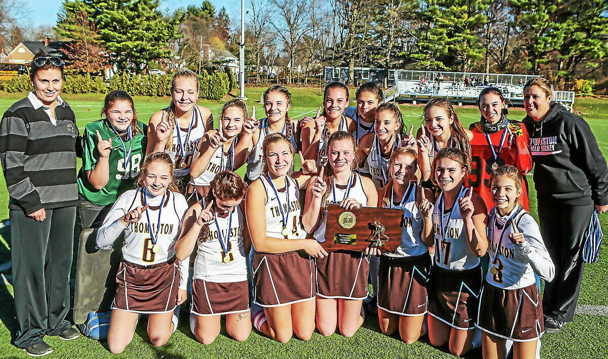 Thomaston Golden Bears celebrate their 2-1 win over The Haddam-Killingworth Courgars 2-1 to claim the CIAC Class S Field Hockey crown at Weathersfield High School Saturday-John Vanacore/New Haven Register