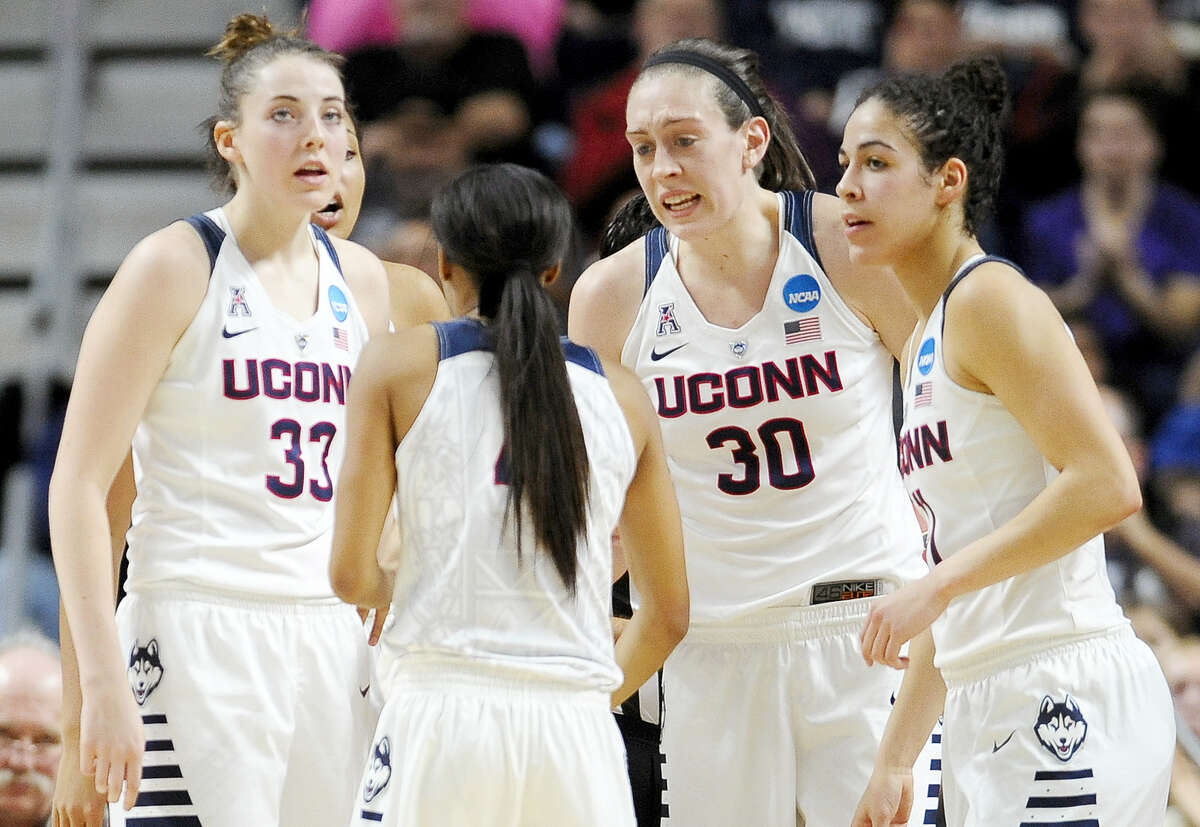 Connecticut’s Breanna Stewart (30) talks to teammates Katie Lou Samuelson (33), Moriah Jefferson, second from left, and Kia Nurse, right, during the first half of a college basketball game against Texas in the regional final of the women's NCAA Tournament, Monday, March 28, 2016, in Bridgeport, Conn. (AP Photo/Jessica Hill)