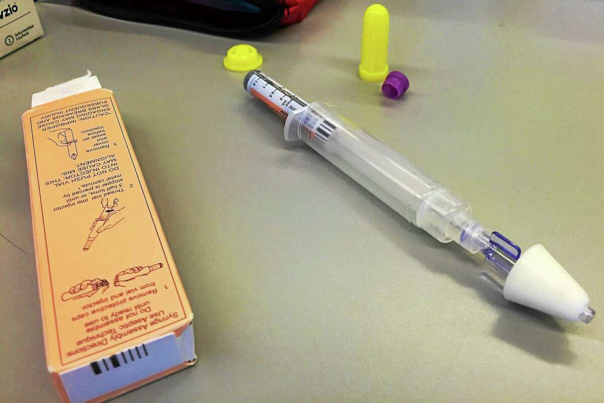 An intranasal device used to dispense Narcan is assembled from three pieces.