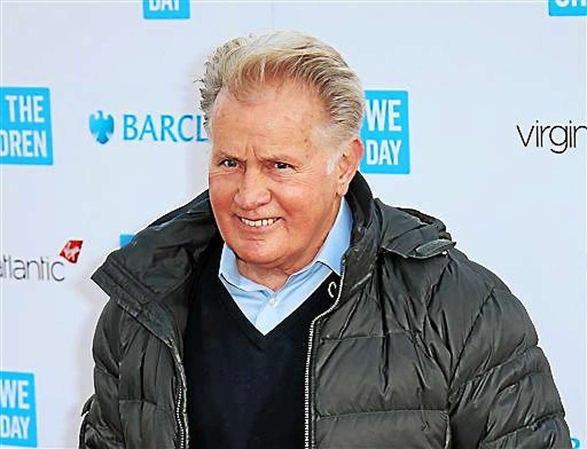 FILE - In this March 5, 2015 file photo, actor Martin Sheen poses for photographers on arrival at We Day UK at Wembley Arena, in west London. The University of Dayton will give actor Martin Sheen an honorary degree in recognition of his activism for peace, social justice and human rights. The school says the 74-year-old Sheen will receive an honorary doctor of humane letters degree at graduation ceremonies May 3 at the University of Dayton Arena. (Photo by Joel Ryan/Invision/AP, File)