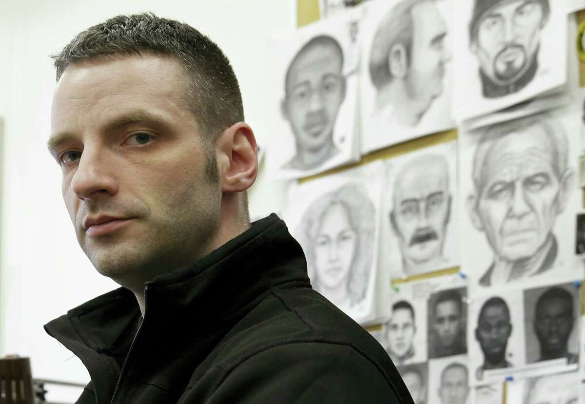 In this March 23, 2016 photo, police officer Matthew Klein poses for a picture at his desk in the NYPD Artist Unit in New York. There are only about 100 full-time forensic artists left in the United States. Law enforcement officials say the work remains valuable because surveillance cameras and bystander cellphones can’t be everywhere. Also because crimes that are caught on video don’t always capture the suspect’s face.