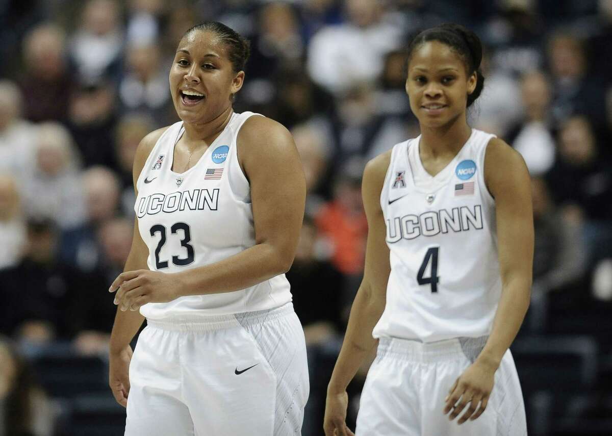 UConn’s Kaleena Mosqueda-Lewis and teammate Moriah Jefferson share a laugh during the first half of Monday’s game at Gampel Pavilion.