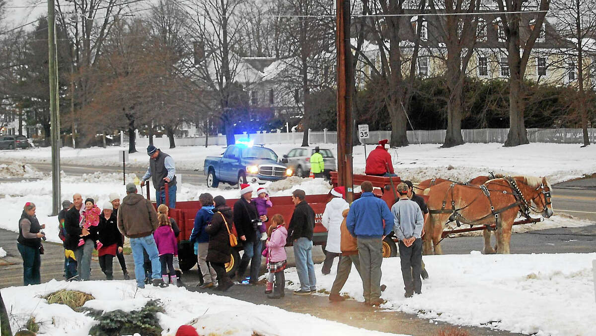 Participants in the 2014 Litchfield Holiday Stroll and Tree Lighting wait for a horse and buggy ride, courtesy of Bunnell Farm.