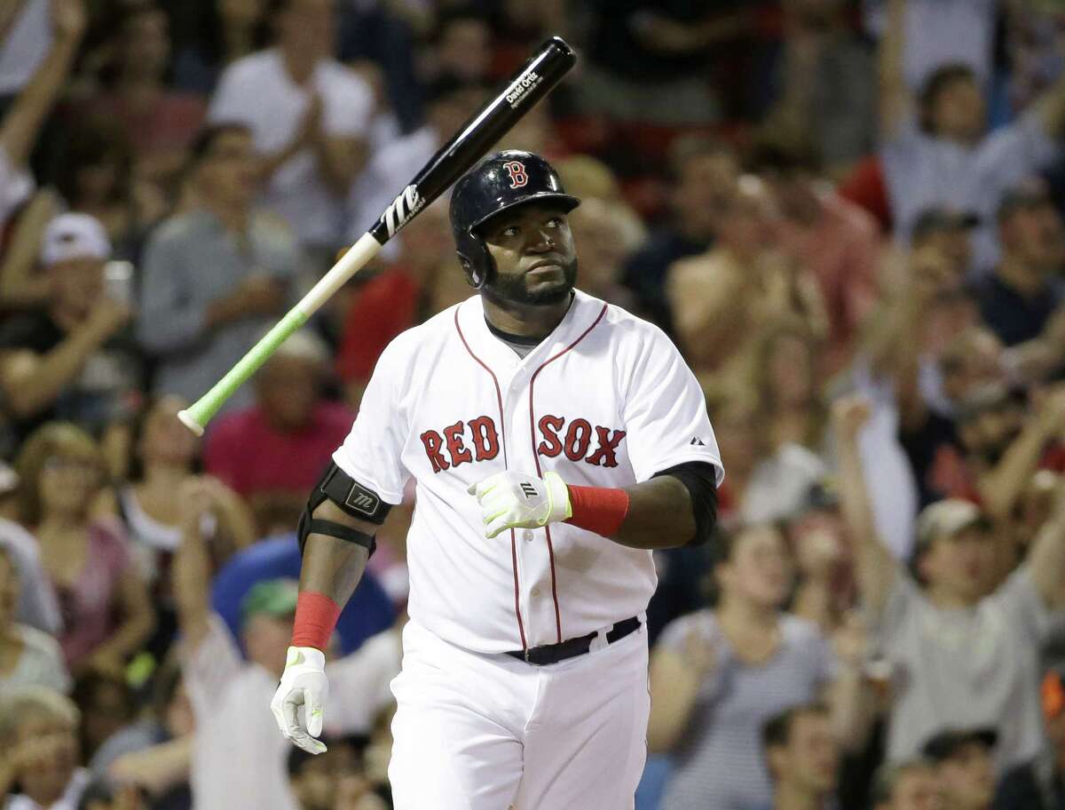 David Ortiz tosses the bat as he watches the flight of his three-run home run in the fifth inning Sunday against the Tigers.