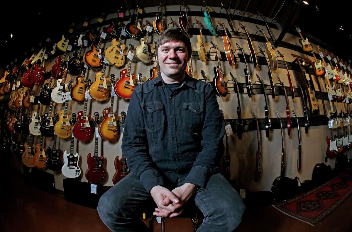 Brian Douglas is photographed at the Cream City Music store in Brookfield, Wis. Cream City Music sells more than 1,800 items from guitar picks to vintage instruments on Reverb.com, a musical equipment marketplace.