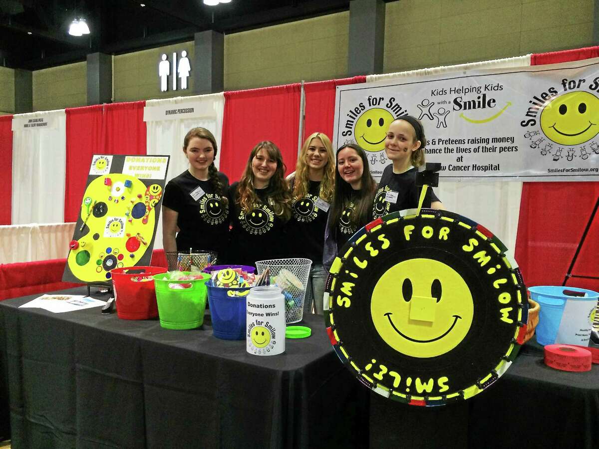 Photo courtesy of Lexi Minutillo Lexi Minutillo (second from left) with members of her Smiles for Smilow organization at a charity event.