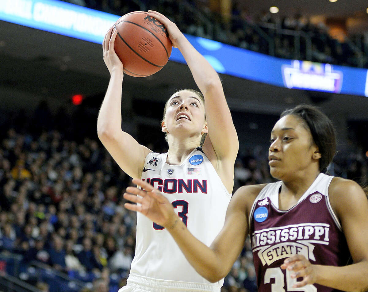 Connecticut's Katie Lou Samuelson, left, shoots over Mississippi State's Victoria Vivians during the first half of an NCAA college basketball game in the regional semifinals of the women's NCAA Tournament, Saturday, March 26, 2016, in Bridgeport, Conn. (AP Photo/Jessica Hill)