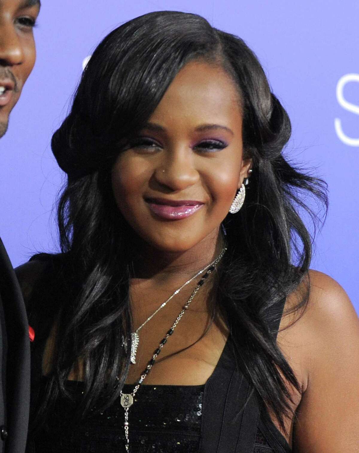FILE - In this Aug. 16, 2012, file photo, Bobbi Kristina Brown attends the Los Angeles premiere of "Sparkle" at Grauman's Chinese Theatre in Los Angeles. The daughter of the late singer and entertainer Whitney Houston, who was in hospice care after months of receiving medical care, died on Sunday, July 26, 2015. (Photo by Jordan Strauss/Invision/AP, File)