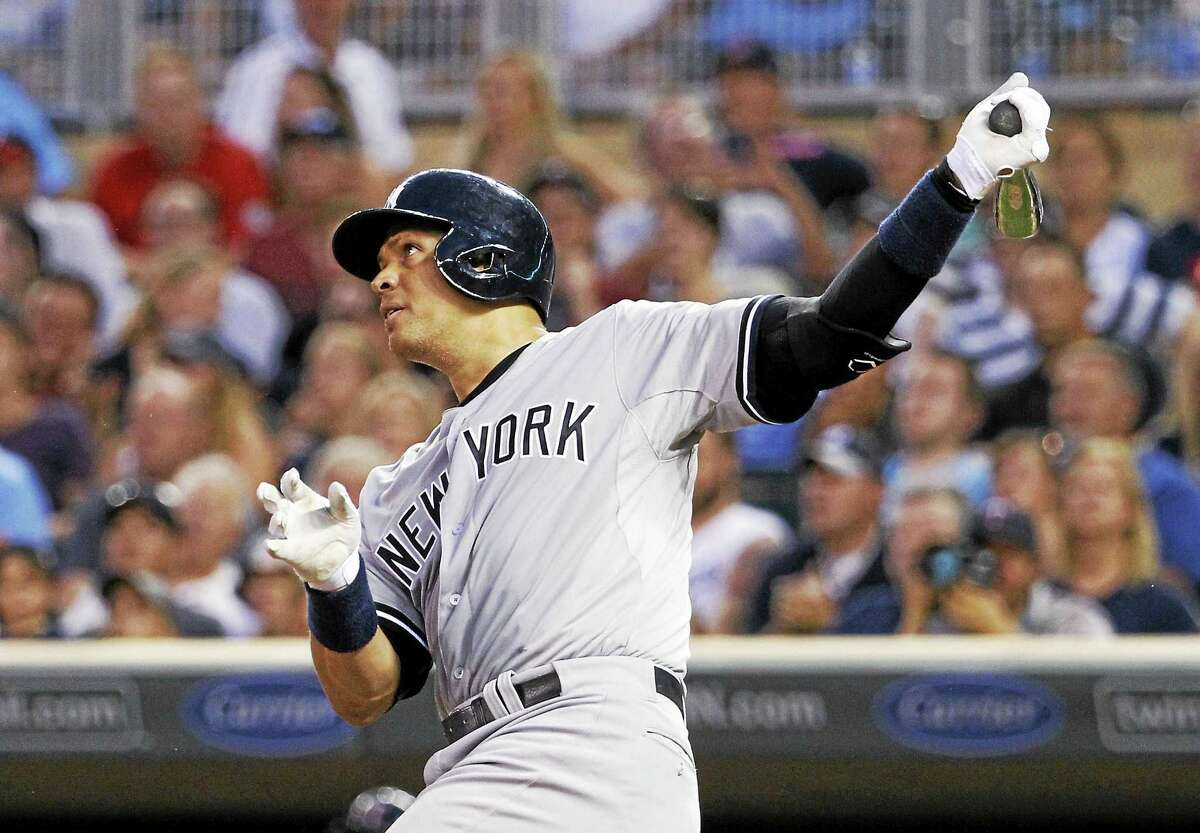 Alex Rodriguez follows through on a solo home run in the ninth inning on Saturday.