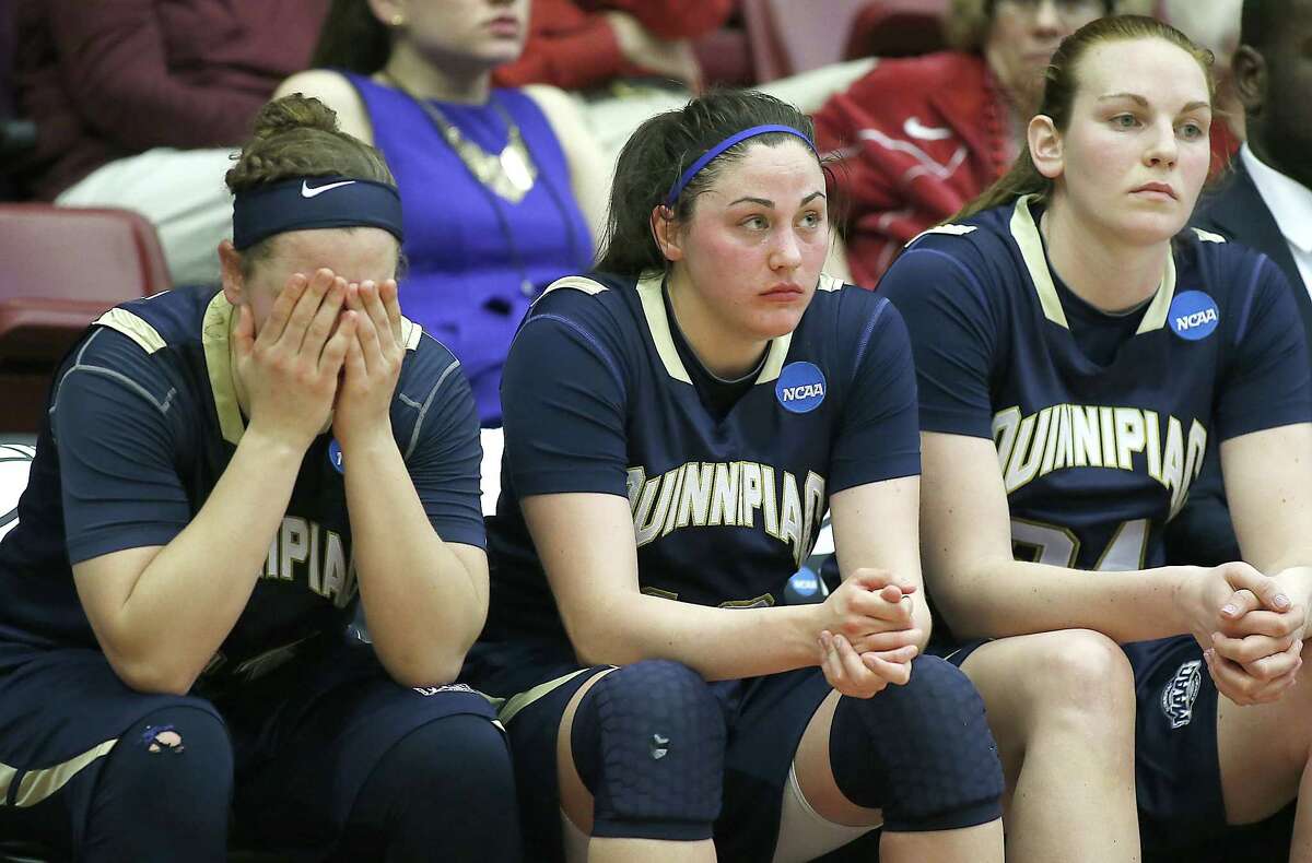 From left, Quinnipiac’s Gillian Abshire, Maria Napolitano and Val Driscoll react to the Bobcats’ loss to Oklahoma in the first round of the NCAA tournament on Saturday in Stanford, Calif.