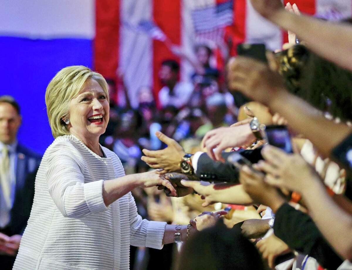 Democratic presidential candidate Hillary Clinton greets supporters as she arrives to speak during a presidential primary election night rally, Tuesday, June 7, 2016, in New York.