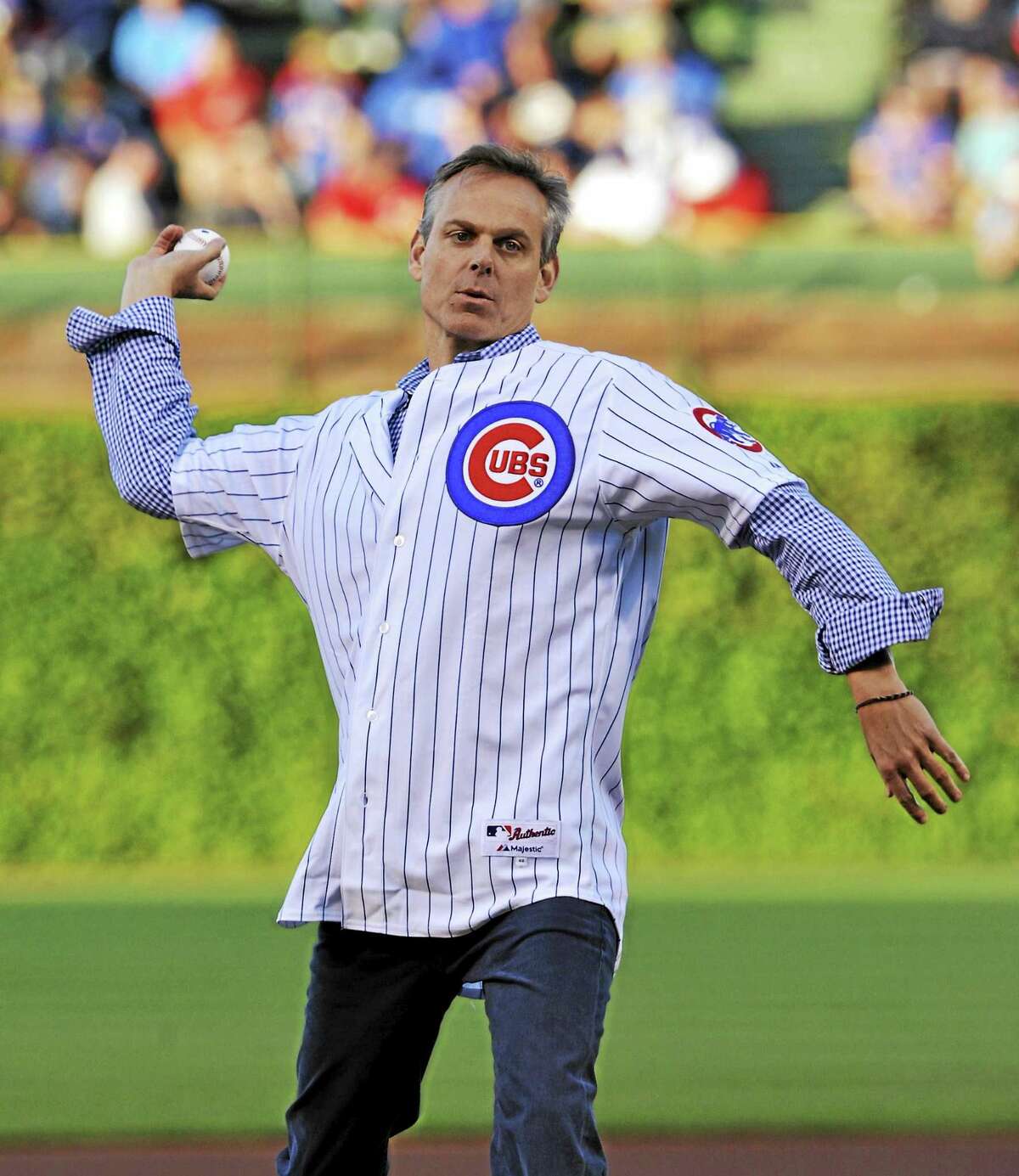 Colin Cowherd tosses out the first pitch before a Reds-Cubs game in 2013 in Chicago.