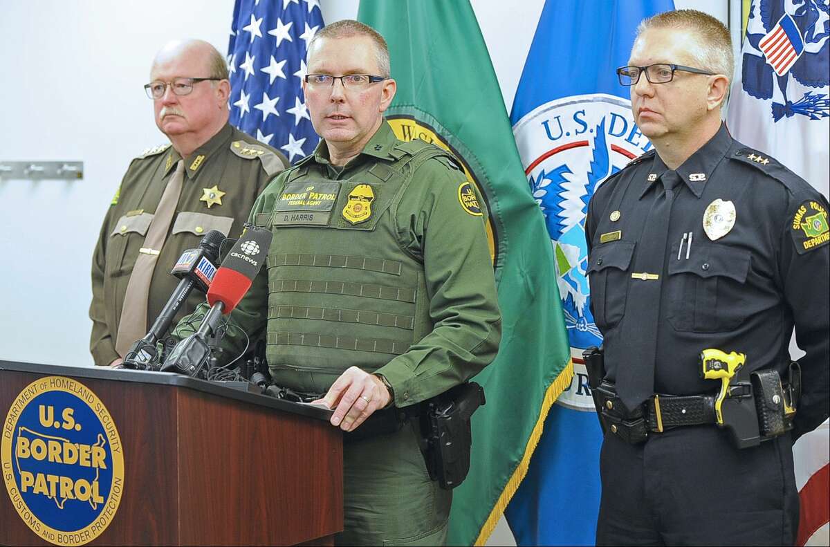 During a press conference at the U.S. Border Patrol office in Sumas, Wa., Friday, March 20, 2015, Whatcom County Sheriff Bill Elfo, left, Chief Patrol Agent Dan M. Harris, Jr.and Sumas Police Chief Chris Haugen, discuss the shooting death of a Canadian man by a U.S. Border Patrol agent in Sumas Thursday. (AP Photo/The Bellingham Herald, Philip A. Dwyer)