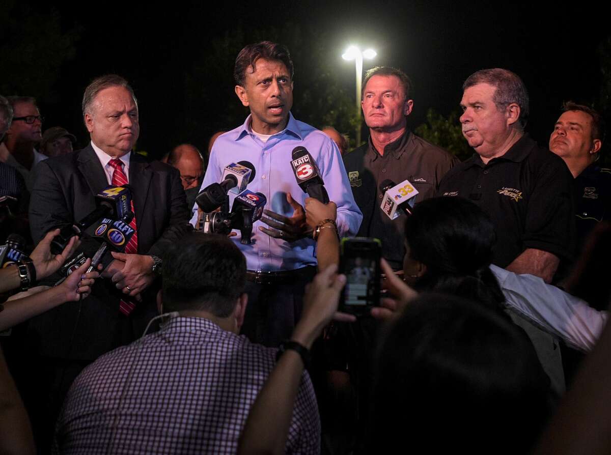 Louisiana Gov. Bobby Jindal speaks with the media as he provides an update on the deadly shooting at the Grand Theatre in Lafayette, La., Thursday, July 23, 2015.