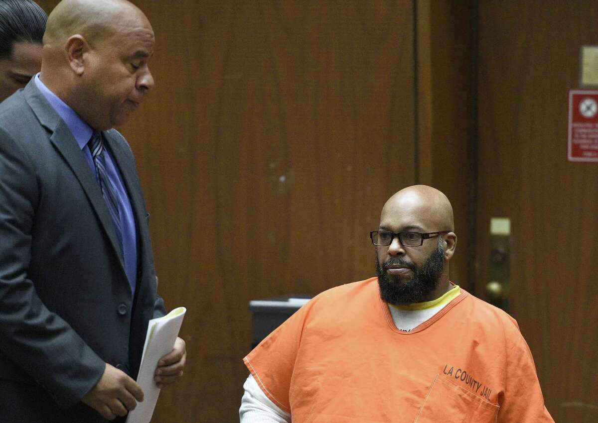 FILE - In this Monday, March 9, 2015 file photo, Marion "Suge" Knight, right, appears with his attorney Matthew Fletcher, left, in court for a hearing about evidence in his murder case in Los Angeles, Calif. Los Angeles prosecutors are asking a judge to set bail in a murder case against the former rap music mogul Knight at $25 million citing his violent history. The motion filed by Deputy District Attorney Cynthia Barnes on Thursday, March 19, 2015, cites 31 incidents in which Knight is accused of threatening others or using violence. (AP Photo/Kevork Djansezian, Pool, File)