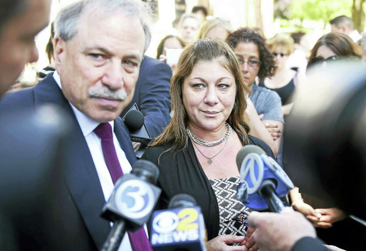 Donna Cimarelli-Sanchez, center, mother of Maren Sanchez, speaks with the press, accompanied by her attorney, David Golub, left, outside of Superior Court in Milford after the sentencing of Christopher Plaskon on Monday.