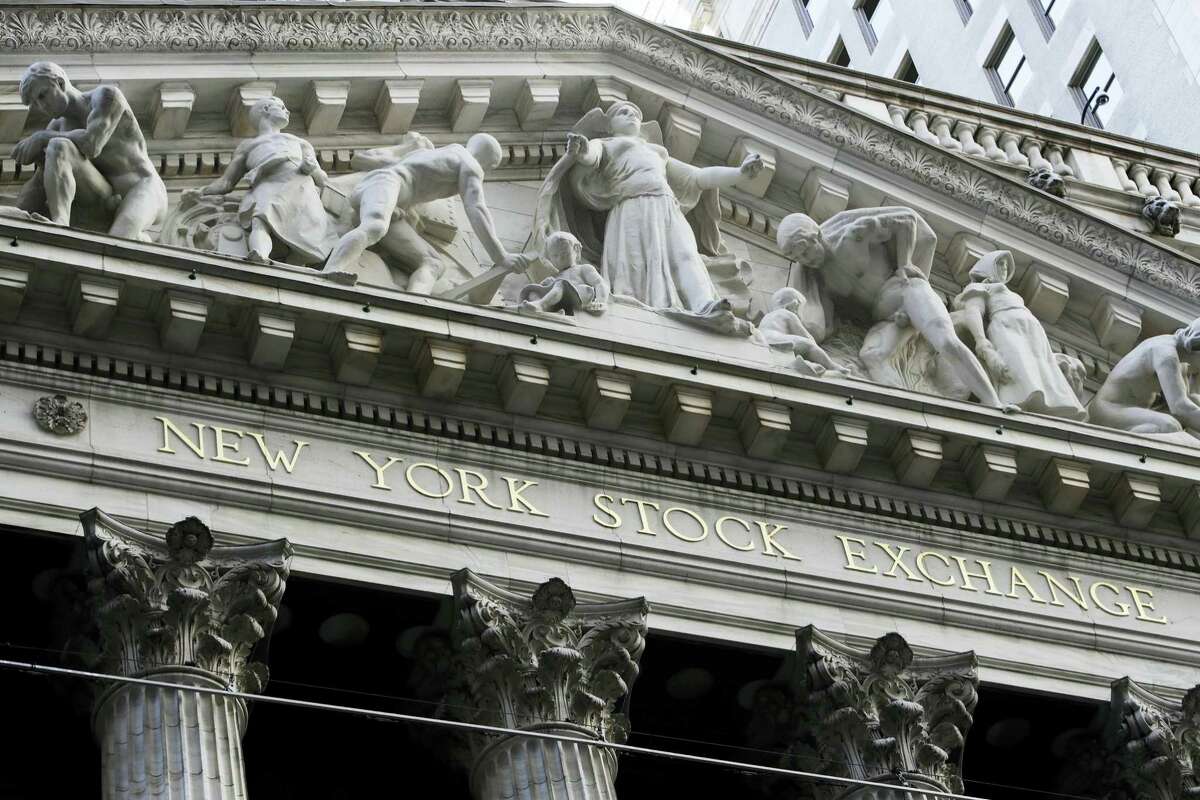 This Tuesday, Oct. 11, 2016, photo shows the New York Stock Exchange. Technology stocks led a broad reverse in global markets on Wednesday after Samsung downgraded its profit estimates and networks company Ericsson warned on its outlook. Investors will later look to the minutes of the U.S. Federal Reserve's last meeting for hints on how quickly interest rates might be raised.