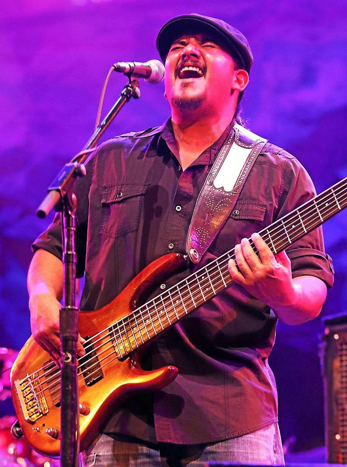 Photo by John Atashian Bassist Jojo Garza of the Los Lonely Boys is shown performing on stage at the Wolf Den Lounge in the Mohegan Sun Casino during the bands free show on Saturday, March 14. The band is currently on tour in support of their new CD, “ Revelation.”