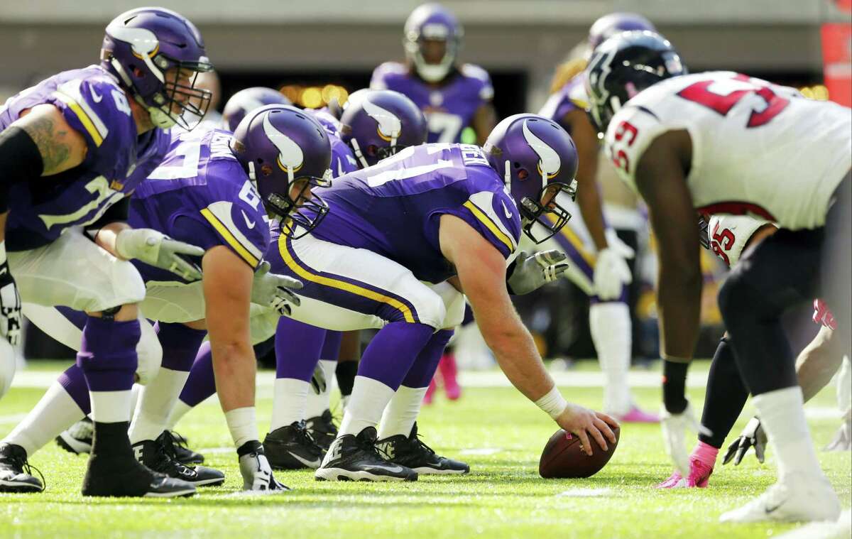 Players get set on the line of scrimmage during the first half of an NFL football game between the Minnesota Vikings and the Houston Texans on Oct. 9, 2016 in Minneapolis.
